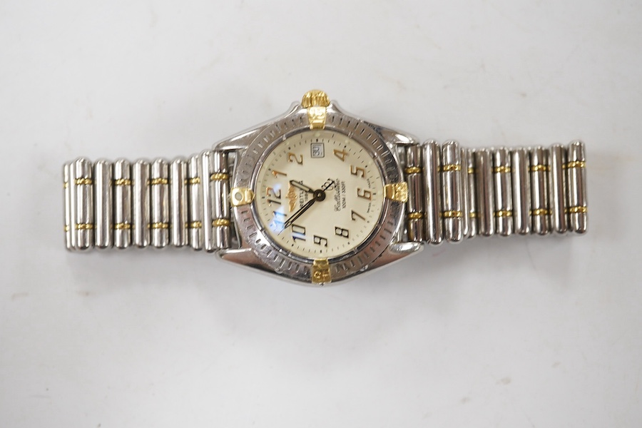 A lady's recent stainless steel and gold Breitling Callistino quartz wrist watch, with Arabic dial and date aperture, case diameter 26mm, on a Breitling bracelet, no box or papers. Condition - not currently running other